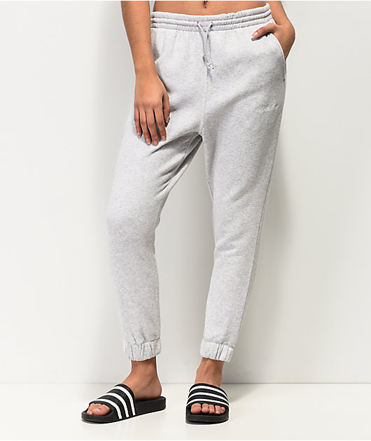 grey adidas sweatpants with white stripes