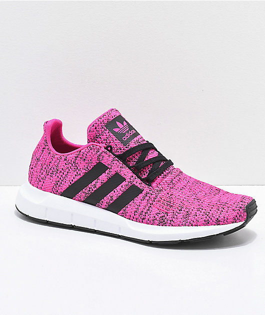 pink and black adidas sneakers