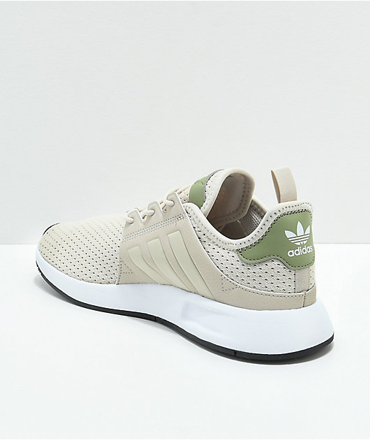 white adidas shoes with green back