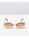 Gafas de sol ovaladas marrones sin montura