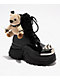 KOI x The Rocky Horror Picture Show Eddie's Teddy Spike Black & Chrome Platform Boots - Thumbnail image 1 of 7