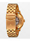 Nixon Spectra reloj analógico negro y dorado